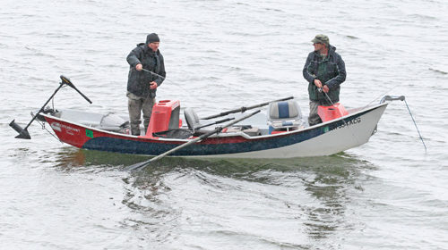 Henry Hughes (right) casts with Craig Schuhmann editor of Flyfishing & Tying Journal, during the Northwest Outdoor Writer's fishing derby on Diamond Lake, April, 29, 2016. Photo by Dennis Kirkland. 