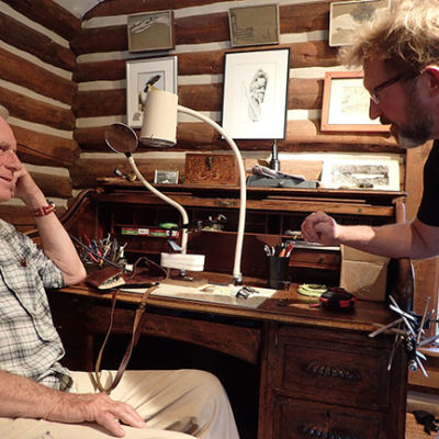 Talking with Tom McGuane over his tying desk, September, 2018. Photo by Chloe Hughes.