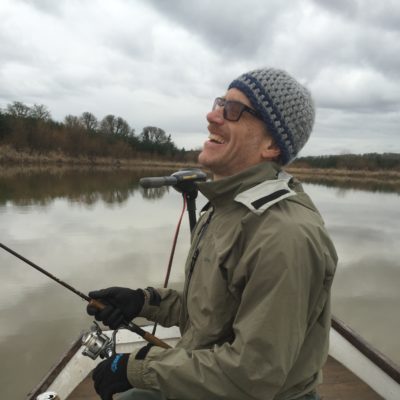 Photographer, illustrator and engineer, Paul Shirkey, laughs on Turner Lake, January, 2017.