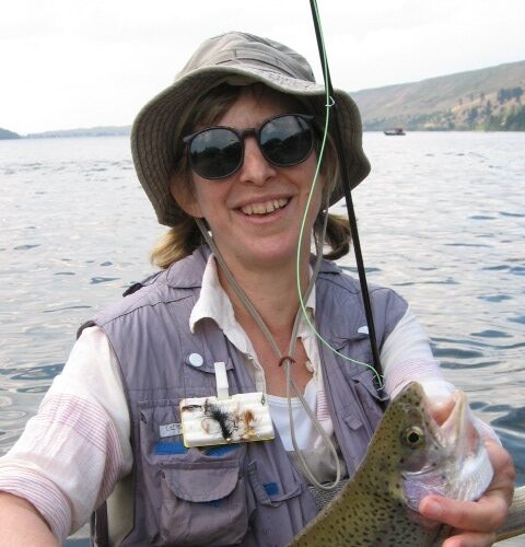 Professor Marjorie Sandor with a rainbow trout from Wallowa Lake, Fishtrap Writers Gathering, 2012. 